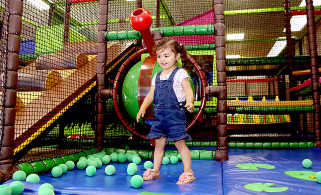 Young girl in a soft play area play ground